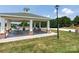 Community pavilion with picnic tables, great for gatherings and outdoor dining at 11317 Trailside Nw Rd, Huntersville, NC 28078