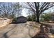 Spacious backyard with detached workshop and mature tree at 1138 Norland Rd, Charlotte, NC 28205