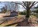 Large backyard with detached workshop and mature tree at 1138 Norland Rd, Charlotte, NC 28205