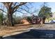 Brick home with a large backyard and detached garage at 1138 Norland Rd, Charlotte, NC 28205