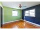 Spacious bedroom with hardwood floors and two-toned walls at 1138 Norland Rd, Charlotte, NC 28205