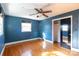 Serene bedroom with hardwood floors and blue walls at 1138 Norland Rd, Charlotte, NC 28205