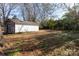 Detached garage with wooden doors and large yard at 1138 Norland Rd, Charlotte, NC 28205