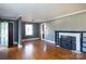 Living room with hardwood floors, fireplace, and built-in shelves at 1138 Norland Rd, Charlotte, NC 28205