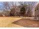 Expansive backyard of a new construction home, featuring level ground and fresh straw, offering a blank canvas at 116 Durham Rd, Stanley, NC 28164