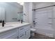 This bathroom features double sinks, dark hardware, and a shower/bath combo at 116 Durham Rd, Stanley, NC 28164