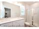 Modern bathroom with double vanity, shower, and updated fixtures at 116 Durham Rd, Stanley, NC 28164