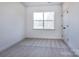 This bedroom features natural light from a window and neutral carpet flooring for comfort at 116 Durham Rd, Stanley, NC 28164