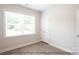 Bright bedroom with wood floors, large window, and spacious closet at 116 Durham Rd, Stanley, NC 28164