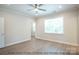 Comfortable bedroom with wood flooring, large window, and private access to closet at 116 Durham Rd, Stanley, NC 28164