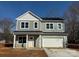 Two-story house with white garage door at 116 Durham Rd, Stanley, NC 28164