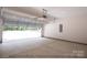 Spacious garage with open overhead door at 116 Durham Rd, Stanley, NC 28164