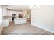 Modern kitchen with island, stainless steel appliances, and light wood flooring at 116 Durham Rd, Stanley, NC 28164