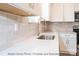 Kitchen features a sink, faucet, and beige backsplash at 116 Durham Rd, Stanley, NC 28164