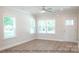 Spacious living room with hardwood floors, neutral walls and large windows at 116 Durham Rd, Stanley, NC 28164