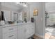 Modern bathroom with white vanity, spacious countertop, and a glimpse of a gym at 122 Still Creek Dr, Mooresville, NC 28115