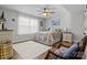 Charming bedroom with a queen-size bed and ample natural light at 122 Still Creek Dr, Mooresville, NC 28115