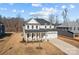 Two-story house with white siding, gray roof, and a front porch at 122 Still Creek Dr, Mooresville, NC 28115