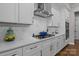 Modern kitchen features a gas cooktop and herringbone backsplash at 122 Still Creek Dr, Mooresville, NC 28115