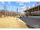 Large patio adjacent to a screened porch, offering outdoor living space at 122 Still Creek Dr, Mooresville, NC 28115