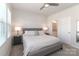 Serene bedroom featuring a ceiling fan, neutral tones, and an ensuite bathroom entrance at 12849 Robert Walker Dr, Davidson, NC 28036