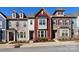 Beautiful townhome showcases a colorful facade with red accents and manicured landscaping at 12849 Robert Walker Dr, Davidson, NC 28036