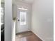 Bright foyer features a decorative front door, fresh paint, and hardwood flooring at 12849 Robert Walker Dr, Davidson, NC 28036