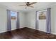 Bright bedroom with dark wood floors and ceiling fan at 133 Fieldstone Farm Dr, Statesville, NC 28625