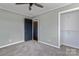 Bedroom with grey carpet, ceiling fan and closet at 133 Fieldstone Farm Dr, Statesville, NC 28625