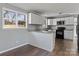 Modern kitchen with granite counters and white cabinets at 133 Fieldstone Farm Dr, Statesville, NC 28625