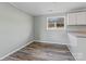 Kitchen with white cabinets and laminate floor at 133 Fieldstone Farm Dr, Statesville, NC 28625