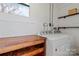 Laundry room with washer, dryer, and shelving at 133 Fieldstone Farm Dr, Statesville, NC 28625