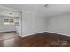 Living room with hardwood floors and kitchen view at 133 Fieldstone Farm Dr, Statesville, NC 28625