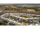 An aerial view of a residential neighborhood with well-maintained homes and lush greenery at 1355 Amberlight Cir, Salisbury, NC 28144