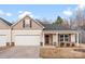 Charming single-Gathering home with a two-car garage, covered entrance, and neutral-colored exterior at 1355 Amberlight Cir, Salisbury, NC 28144