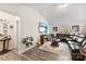 Comfortable living room featuring hardwood floors, a fireplace, and plenty of natural light at 1355 Amberlight Cir, Salisbury, NC 28144