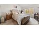 Cozy main bedroom showcasing a comfortable king-size bed, soft carpet, and a view of the outdoors at 1355 Amberlight Cir, Salisbury, NC 28144