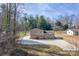 Aerial view of a split-level home with brick and siding exterior, and a long driveway at 1401 Southwest Blvd, Newton, NC 28658