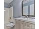 Bathroom featuring a shower-tub combo with a white vanity at 1401 Southwest Blvd, Newton, NC 28658