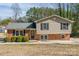 Charming split-level home with brick and siding exterior, neat landscaping, and classic curb appeal at 1401 Southwest Blvd, Newton, NC 28658