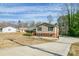 Charming split-level home with brick and siding exterior, long driveway, and classic curb appeal at 1401 Southwest Blvd, Newton, NC 28658