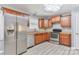 A modern kitchen featuring stainless steel appliances, wood cabinets, and great natural light at 1401 Southwest Blvd, Newton, NC 28658