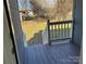 View of backyard from deck; grassy area and detached structure at 1440 Rhodes Rhyne Rd, Lincolnton, NC 28092