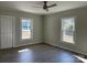 Well-lit bedroom with vinyl flooring and ceiling fan at 1440 Rhodes Rhyne Rd, Lincolnton, NC 28092