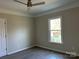 Bedroom with vinyl flooring, ceiling fan, and window at 1440 Rhodes Rhyne Rd, Lincolnton, NC 28092