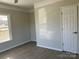 Bedroom with vinyl flooring, ceiling fan, and ample closet space at 1440 Rhodes Rhyne Rd, Lincolnton, NC 28092