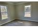 Bright bedroom with new flooring and large windows at 1440 Rhodes Rhyne Rd, Lincolnton, NC 28092