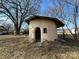 Unique round structure with stone base and wooden door at 1440 Rhodes Rhyne Rd, Lincolnton, NC 28092