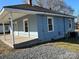 Side view of house showcasing a porch at 1440 Rhodes Rhyne Rd, Lincolnton, NC 28092