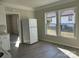 Kitchen with white cabinets and view to backyard at 1440 Rhodes Rhyne Rd, Lincolnton, NC 28092